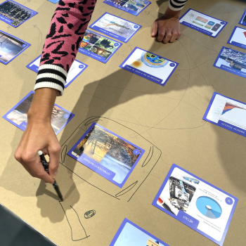 A participant adds a small drawing on the Collage